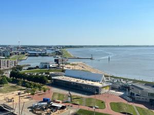 an aerial view of a city with a body of water at Ebbe u Flut Bremerhaven in Bremerhaven