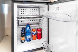 an open refrigerator with soda and sodas in it at Porta da mar in Venice
