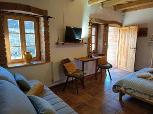 a living room with a couch and a table with chairs at Penzion PROVANS - Pálava in Dolní Dunajovice +92 photos