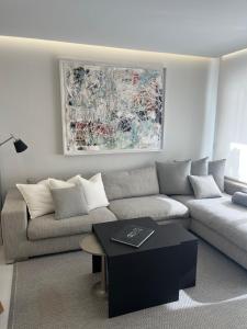 a living room with a couch and a table at Minerva Beach in Port d'Alcudia