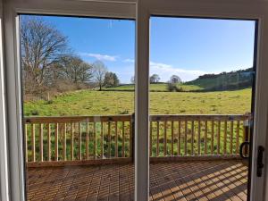 a view of a field from the front door at Countryside Cabin in Charlestown +5 photos