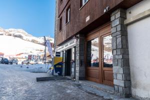 a building with a door on the side of it at HelloCHALET - Friends Ski House in Breuil-Cervinia
