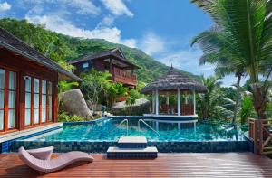 a pool at a resort with a gazebo at Niva Labriz Seychelles in Silhouette Island