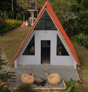 a small dog house with two domes on the ground at Kamalú Glamping in Medellín