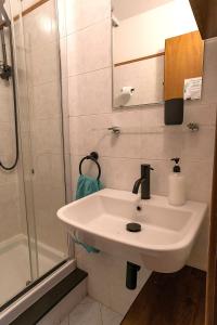 a bathroom with a sink and a shower at Macaia Village Life Room with AC #2 in Vernazza +15 photos