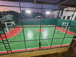 an indoor basketball court at night with people on it at Eco Resort QUINTA SANTA BÁRBARA in Pirenópolis