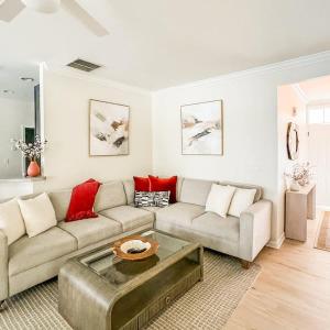 a living room with a couch and a table at Spacious Private 2BR-2BA I Pool I Garage I Central in Rehoboth Beach