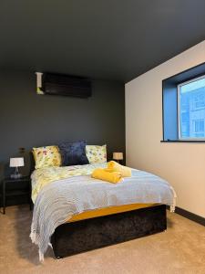 a bedroom with a bed and a window at The Resting Place in Aberystwyth