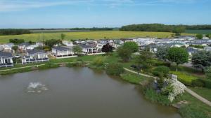 an aerial view of a town with a lake at 7 Park Lane Patrington Haven Leisure Park in Patrington