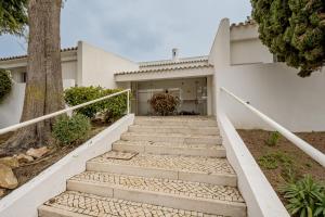 a set of stairs leading to a house at Quinta do Lago Duplex - Beach & Golf Algarve in Loulé