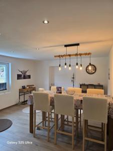 a dining room with a table and chairs at Appartement de Charme in Bévilard