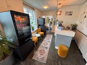 a living room with a large video game at Stad & Strandhotel Elisabeth in Vlissingen