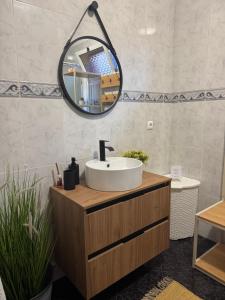 a bathroom with a sink and a mirror at Ponta do Sol Villa in Ponta do Sol +62 photos