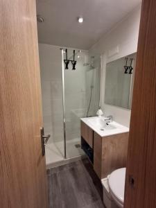 a bathroom with a shower and a sink and a toilet at Candela's Beach Port in El Masnou +27 photos