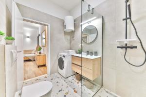 a bathroom with a shower and a toilet and a sink at IPM Apartments Kaštela, parking, pool, 10 minutes from Split airport in Kaštela +54 photos