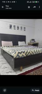 a bed in a room with at Panahh in Guwahati
