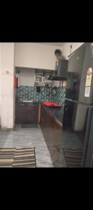 a kitchen with a stove top oven in a kitchen at Panahh in Guwahati