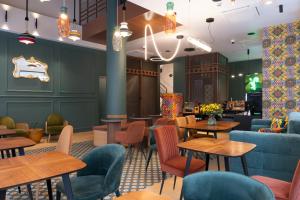 a restaurant with tables and chairs and a bar at Athens Retro in Athens