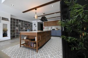 a kitchen with a wooden island in a room at Hal Wardija - Gozo Hideaways in Qala