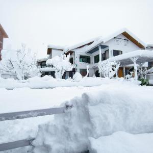 a pile of snow in front of a house at Id villa in Tangmarg +10 photos