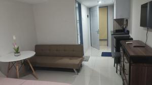 a living room with a couch and a table at Lei's Abode in Mandaue City