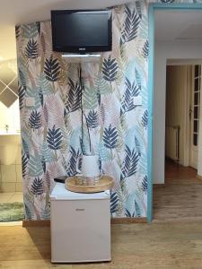 a living room with a wall with a tv on it at Domaine de Fontcouverte in Fontcouverte