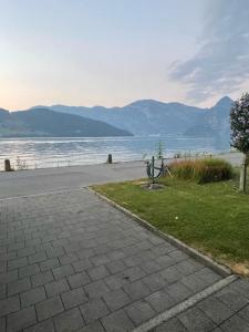 a walkway next to a body of water at Ufer Nest in Buochs in Buochs