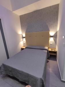 a small bedroom with a bed in a room at Ai Vecchi mulini in Gragnano