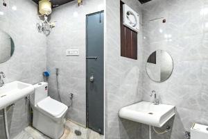 a bathroom with a toilet and a sink and a shower at FabHotel Classic Holidays in Jaipur