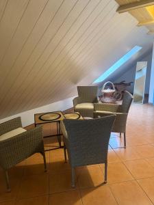 a room with chairs and a table and a table and chairs at Agroturystyka OLD ROAD 11 in Niedźwiedź +19 photos