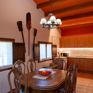 a kitchen with a wooden table with a bowl on it at Casatona in San Mateo de Bages