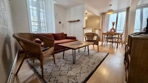 a living room with a couch and a table at Le Saint Jacques - Downtown in Melun