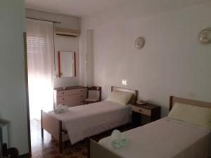Postel nebo postele na pokoji v ubytování Albergo Europa
