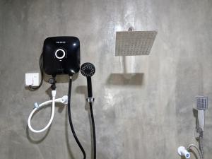 a camera on a wall in a bathroom at Diamond Resorts in Udawalawe