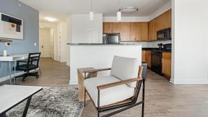 a kitchen and dining room with a table and chairs at Landing Apartments - Prospect Hall in Frederick