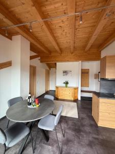 a kitchen and dining room with a table and chairs at Haus Lagger in Seefeld in Tirol