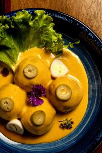 a blue bowl of food with a bunch of vegetables at Las Cabras Complejo Turístico in Potrero de los Funes
