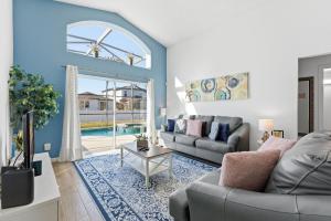 a living room with a couch and a table at 4 BR No carpet Just Remodeled Unit SR1205 in Kissimmee