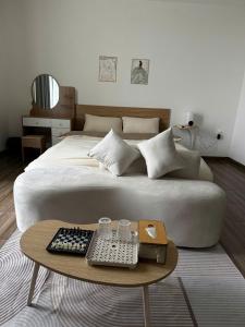 a bedroom with a bed and a table with a keyboard at LucyHouse in Thôn Trường Giang