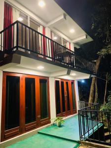 a house with a staircase and a swimming pool at Happy Rest House Ella in Ella
