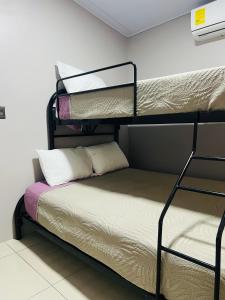 a room with two bunk beds in a room at Epic Arenal View House in Fortuna