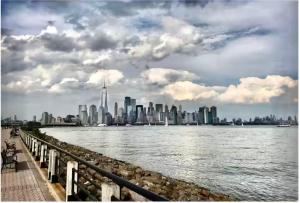 a view of a city from the water at Private Room A-KING BED-12Mints NYCity Times Square in West New York
