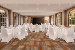 a set up for a banquet in a ballroom with white tables and chairs at Fairview Hotel Nairobi, Vignette Collection by IHG in Nairobi +113 photos