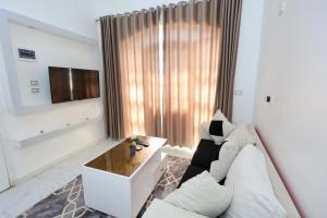 a living room with a couch and a table at White Gorf Hotel in Luxor +213 photos