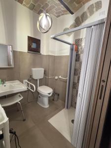 a bathroom with a toilet and a sink at Lo Shangrilá B&B in Borrello +15 photos