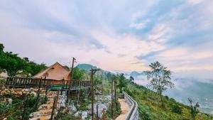 a cabin on top of a hill with a view at Hà Giang Camping in Mèo Vạc