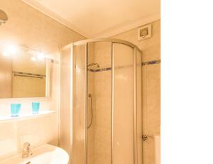 a bathroom with a shower and a sink at Apartements Mitterstill in Völs am Schlern +25 photos
