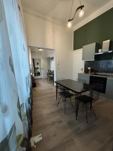a kitchen and dining room with a table and chairs at SVR Green in Bronte +6 photos