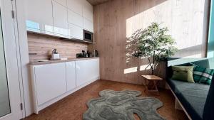 a kitchen with a couch and a table in a room at Flat 4A in Edinburgh