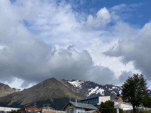 a view of a mountain range with snow covered mountains at Sur Alojamiento Ushuaia in Ushuaia